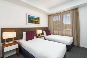 A bed or beds in a room at Quest Toowoomba
