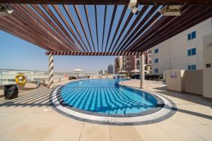 a swimming pool on the roof of a building at Star Metro Deira Hotel Apartments in Dubai