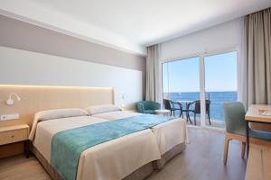 Кровать или кровати в номере Universal Hotel Cabo Blanco - Adults Only