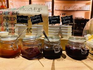 a counter with jars of honey and other food items at Landhaus Hammoor in Hammoor