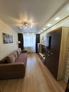 Coin salon dans l'établissement New apartment on prospekt Nauki