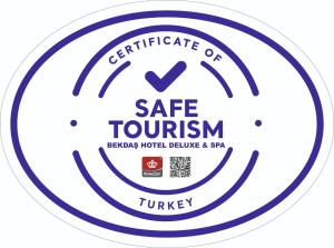 a logo of a safe tourism sign in a circle at Bekdas Hotel Deluxe & Spa in Istanbul