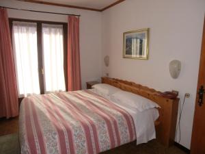 Posteľ alebo postele v izbe v ubytovaní Hotel Piccolo Mondo