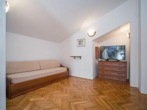 a living room with a couch and a dresser at Apartment Fuma-6 by Interhome in Jadranovo +39 photos