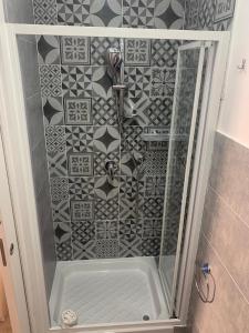 a shower with a glass door in a bathroom at DUOMO 152 NAPOLI in Naples +44 photos