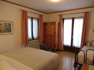 Posteľ alebo postele v izbe v ubytovaní Hotel Piccolo Mondo