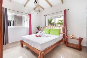 A bed or beds in a room at La Belle Digue Don