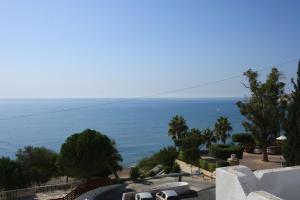 a view of the ocean from a building at Pissouri Beach Apartments in Pissouri