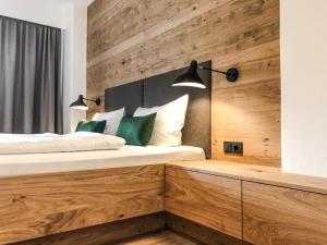 Posteľ alebo postele v izbe v ubytovaní ride & relax Aparthotel Schwarz