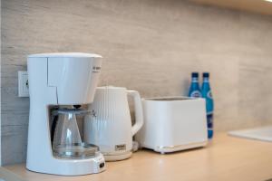 Príslušenstvo na prípravu kávy alebo čaju v ubytovaní Apartment Balticus 19A by Noclegi Renters