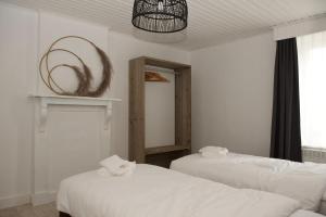 เตียงในห้องที่ Vakantiewoning Oudsbergen