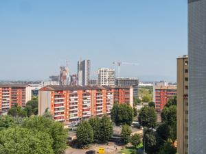a view of a city with tall buildings and trees at The Best Rent - Modern two rooms apartment with balcony in Milan