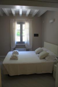 Postel nebo postele na pokoji v ubytování Agriturismo Cascina Carai