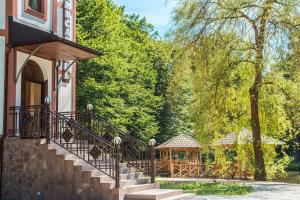 a building with stairs and a gazebo at Мисливець в Комплексі "Сокіл" in Rivne