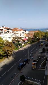 a street with cars parked on the side of the road at Nesebar Vigo Panorama Private Studios in Nesebar