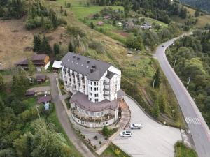 an aerial view of a building on a hill with a road at Terem in Slavske