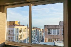 a window with a view of a city at Renzo Hotel in Istanbul