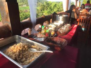 a table with a tray of food on a table at ภูน้ำทิพย์ รีสอร์ท in Ban Huai Phai