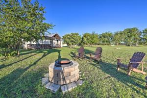 two chairs and a fire pit in a yard at Day Trip to Waco and Temple House on Cattle Farm in Lorena