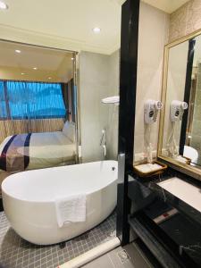 ห้องน้ำของ Cai Mei Hotel