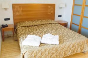 Postel nebo postele na pokoji v ubytování Hotel Continental
