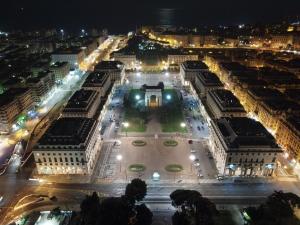 an aerial view of a city at night at Domus Victoria in Genoa