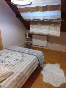 Postel nebo postele na pokoji v ubytování Laissey-vous tenter