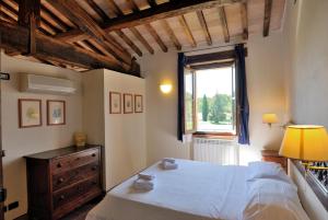En eller flere senge i et værelse på I Casali Della Ghisleria