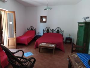 A bed or beds in a room at Pedra Residence