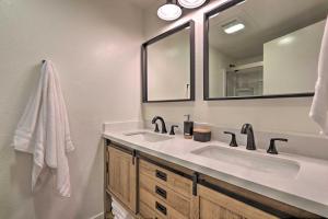 a bathroom with two sinks and a mirror at Deck, Games and Fire Pit Modern Pine Cabin! in Pine +21 photos