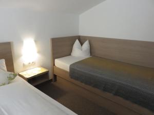 Postel nebo postele na pokoji v ubytování Haus Barbara