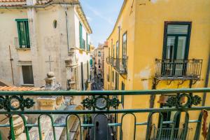 a view of an alley from a balcony at Vinto House Salerno Old Town in Salerno