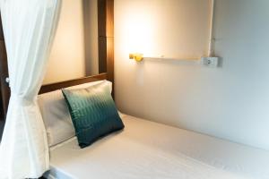 Postel nebo postele na pokoji v ubytování Mystay Hostel Nan