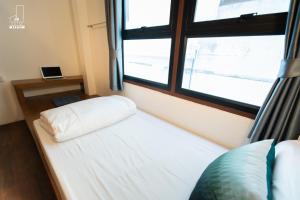 Postel nebo postele na pokoji v ubytování Mystay Hostel Nan