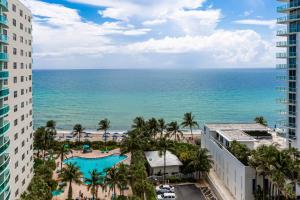 a view of the beach from the balcony of a resort at The Tides Ocean Luxury Suites in Hollywood