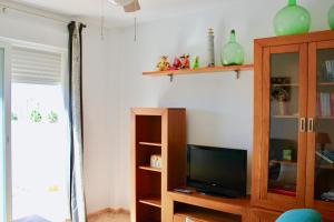 TV a/nebo společenská místnost v ubytování Espectacular Ático con Parking y Terraza con BBQ