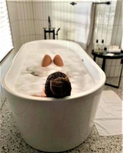 a bath tub with a ball in the middle of it at U Eat & Sleep Antwerp in Antwerp