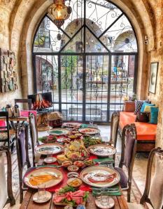 a table with plates of food on top of it at Asuwari Suites Cappadocia in Ürgüp