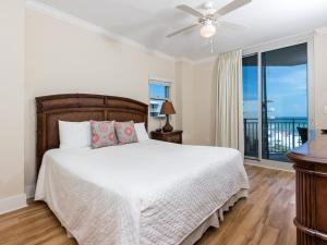 a bedroom with a bed and a large window at Waterscape B III in Fort Walton Beach