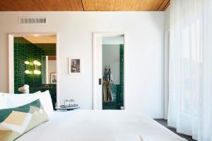 Postel nebo postele na pokoji v ubytování Hotel Magdalena
