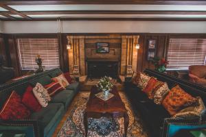 a living room with a couch and a coffee table at Greenway Manor in Bisbee