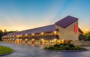 a large building with a lot of windows at Red Roof Inn Kalamazoo East – Expo Center in Kalamazoo