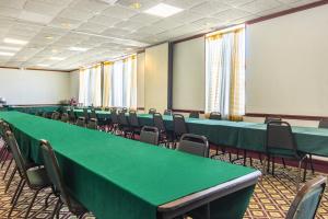 a conference room with green tables and chairs at Red Roof Inn Ashtabula - Austinburg in Ashtabula