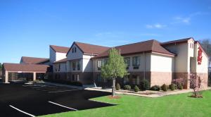 a large office building with a parking lot at Red Roof Inn Gaffney in Gaffney
