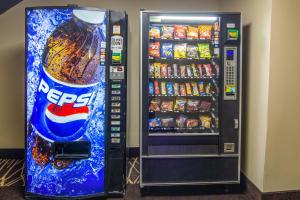 a vending machine with a bottle of cocacola soda at Red Roof Inn Perrysburg in Perrysburg