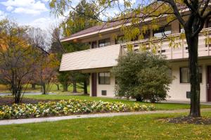 a building with flowers in front of it at Red Roof Inn Philadelphia - Trevose in Trevose