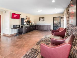 a waiting room with chairs and a counter at Red Roof Inn Dandridge in Dandridge