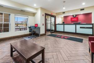 a large lobby with a desk and a reception counter at Econo Lodge Inn & Suites in Monee