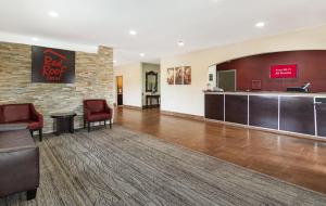 a lobby of a hotel with a red roof room at Red Roof Inn Fort Worth - Saginaw in Fort Worth