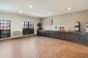 a large room with a counter and windows at Red Roof Inn Fort Worth - Saginaw in Fort Worth